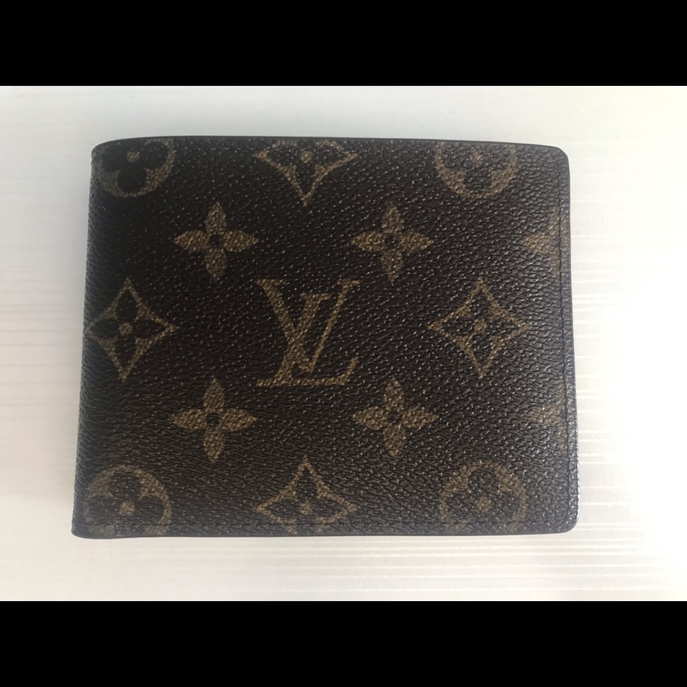 Louis Vuitton multiple pocket wallet.